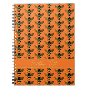 CADERNO ESPIRAL ABELHA NEGRA DOURADA DE BOMBA REPETIDA LARANJA DE