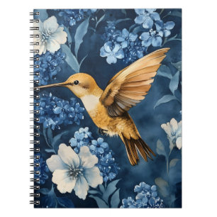 Caderno Espiral beija-flor dourado voando entre azul e branco 