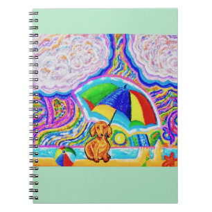 Caderno Espiral Cachorro em um notebook de praia