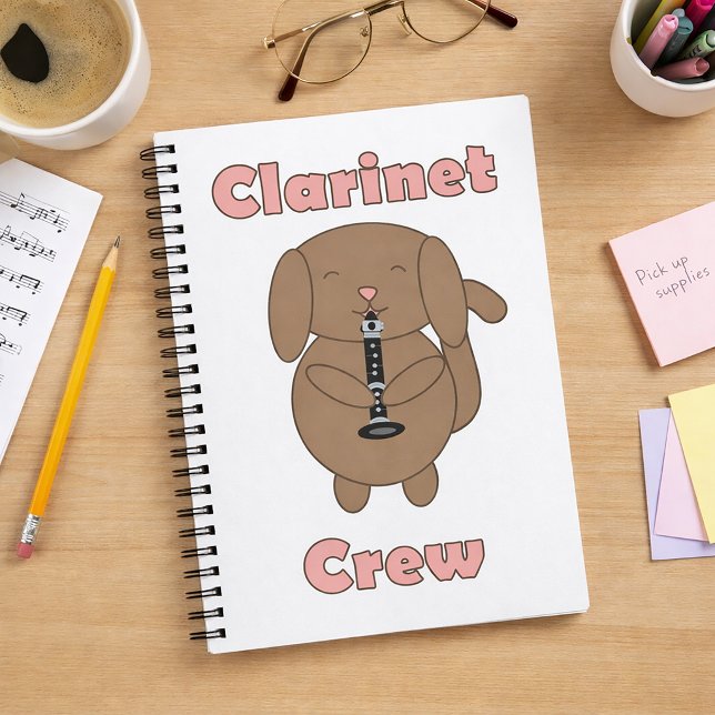 Caderno Espiral Cachorro Marrom Fofo Tocando Clarinete (A notebook with a brown dog playing clarinet and the words clarinet crew.)
