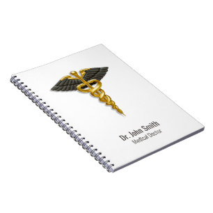 Caderno Espiral Caduceu de Ouro Clássico com Asas Pretas Elegante