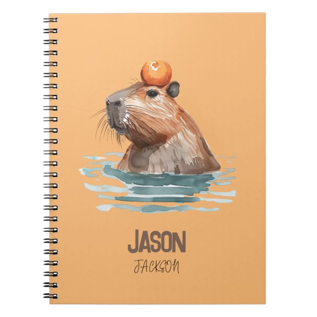 Caderno Espiral Capivara Encantadora e Fofa com Laranja e Nome das (Frente)