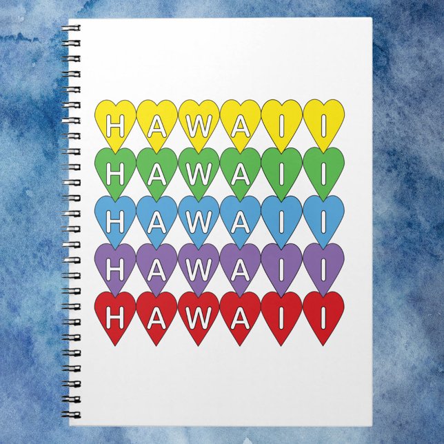 Caderno Espiral Hawaii Hearts Rainbow (A notebook that says Hawaii in yellow, green, blue, purple and red hearts.)