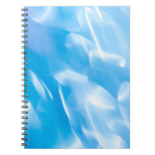 Caderno Espiral Luzes brilhantes de abstrato sobre fundo azul. Red