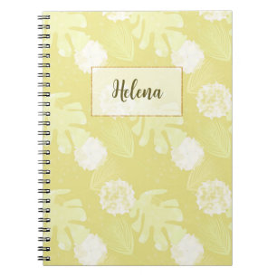 Caderno Espiral Ramais, folhas e flores de cor bege leitoso.