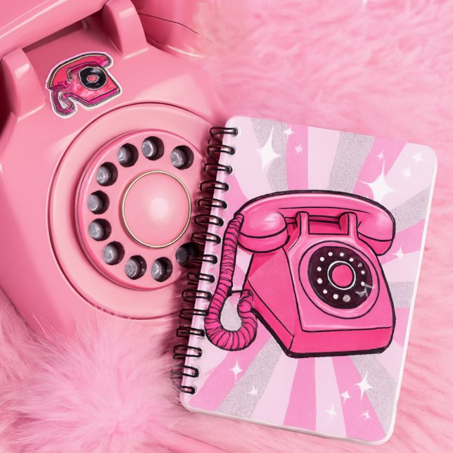 Caderno Espiral Telefone Fixo Rotativo Retro Rosa Brilho (Notebook features a bold pink rotary phone with sparkle pop art rays in pink, white, and silver)