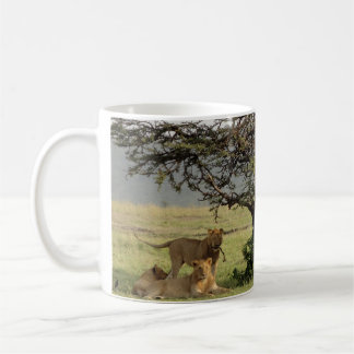 Café Vida com a caneca dos leões com fora de citações