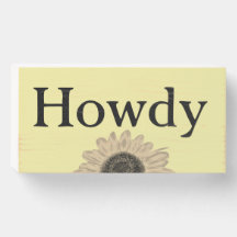 Caixa de madeira com sinal de cumprimento Howdy e 