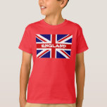 Camisas do T do miúdo com a bandeira de Union Jack<br><div class="desc">Camisas do T do miúdo com a bandeira de Union Jack do inglês. Inglaterra. Design inglês patriótico da bandeira para meninas e meninos. A maneira a mais barata de mostrar suas cores. Ideia legal do presente para eventos reais do partido.</div>