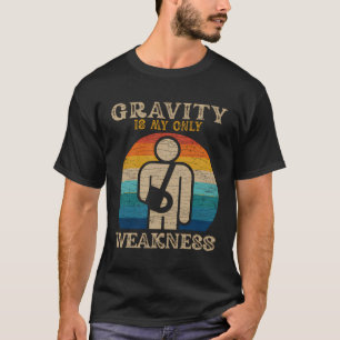 Camiseta A Gravidade É O Meu Único Ferimento De Fraqueza