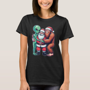 Camiseta Alienígena Bigfoot e Papai Noel acreditam no Engra