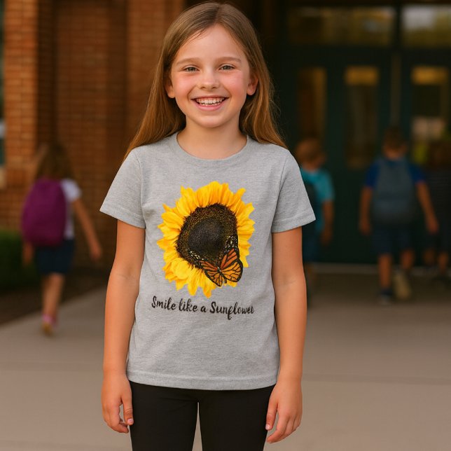 Camiseta Amarela de Meninas com Flor de Girassol (Soft heather gray girls tee featuring a cheerful sunflower and butterfly design)