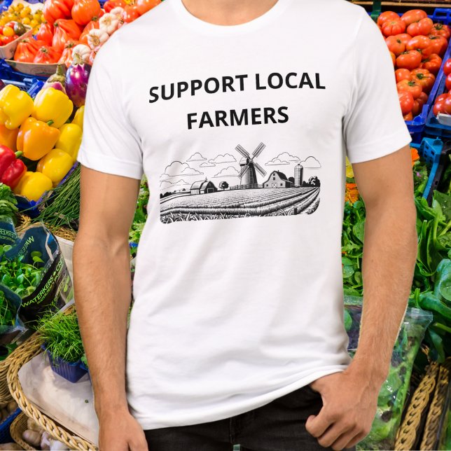 Camiseta Apoiar Os Agricultores Locais Que Arrancam Aquicul (A t-shirt with 'Support Local Farmers' caption and line art arable farm picture with windmill)