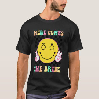 Camiseta Aqui Vem A Noiva Festa de Chá da Despedida Groovy