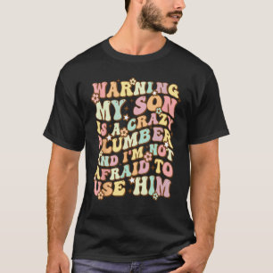 Camiseta Aviso Meu Filho É Um Encanador Louco Pais Groovy D