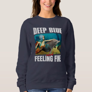 Camiseta Azul profundo e sensação de boa Sereia e golfinho