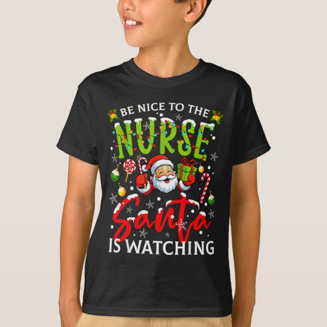 Camiseta Be Nice To The Nurse Santa Is Watching Christmas X (Frente)