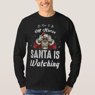 Camiseta Be Nice to The OB Nurse Santa Is Watching Christm