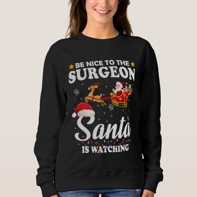 Camiseta Be Nice To The Surgeon Santa Watching Xmas (Frente)