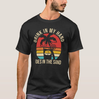 Camiseta beba na minha mão dedos na areia