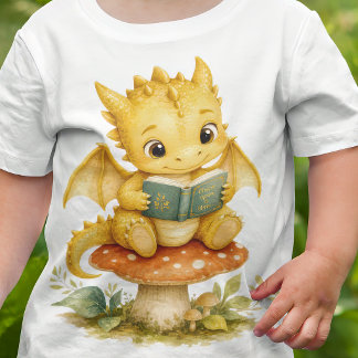 Camiseta Bebê Dragão do Livro de Histórias Lendo em Cogumel