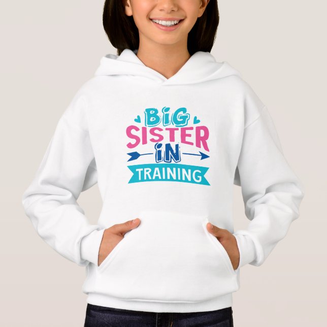 Camiseta Big Sister em Treinamento - Anúncio da Irmã Grande (Frente)