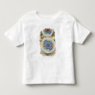 Camiseta Butão. Bolos cerimoniais feitos por monges adornam