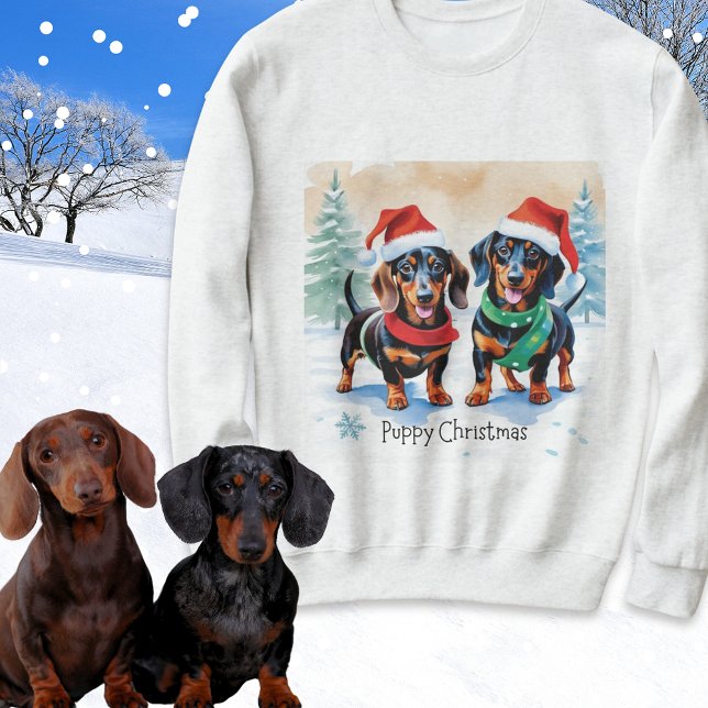 Camiseta Cachorros de Cachorro de Papoila de Natal (A festive sweatshirt with picture of two cute dachshunds and caption 'Puppy Christmas')