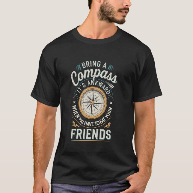 Camiseta Carregue uma Bússola Evite Comer Seus Amigos (Frente)