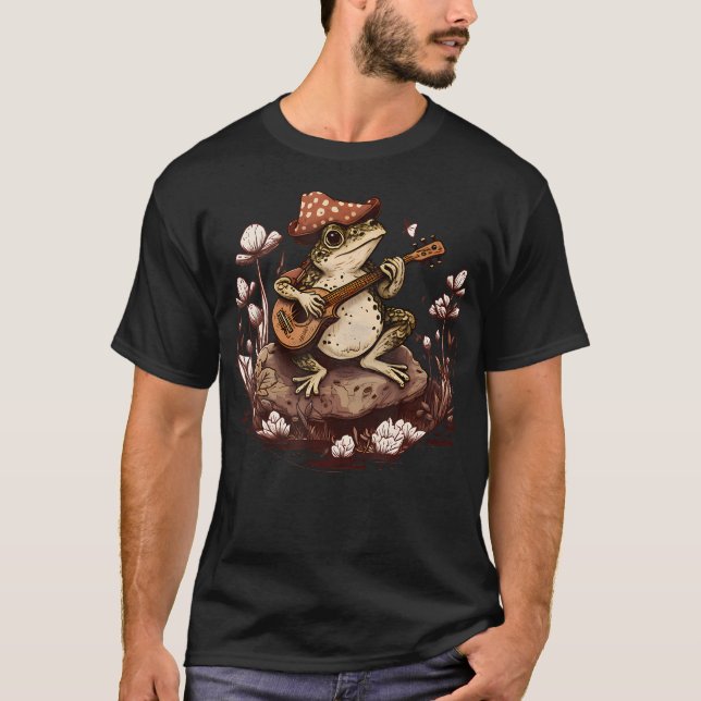 Camiseta Casa de Cogumelo com Sapo Antigo Tocando Banjo Cot (Frente)