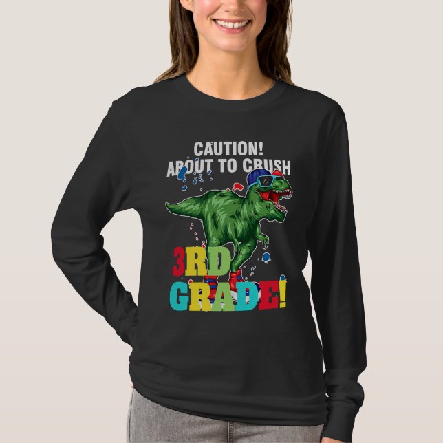 Camiseta caution about to crush 3rd grade graduate (Frente)