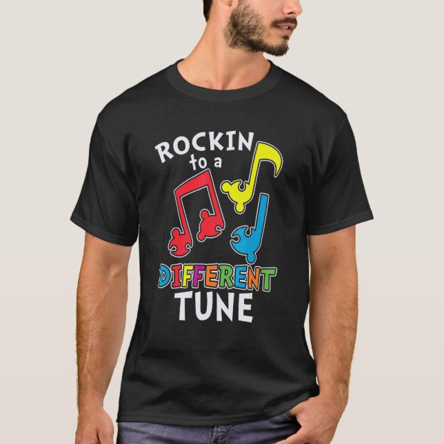 Camiseta colorful puzzle pieces Autism Rockin' to a differe (Frente)
