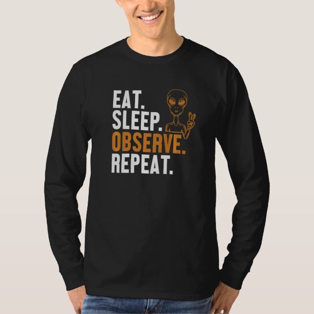 Camiseta Comer Dormir Observar Repetir Conspiração Alieníge (Frente)