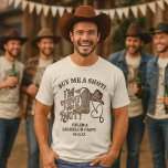 Camiseta Compre-me um Nó Corredio Festa de Solteiro Cowboy<br><div class="desc">Esta camisa fofa é o presente perfeito para o noivo na sua despedida de solteiro. Ela apresenta um design fofo com tema western e letras em estilo de xilogravura vintage que dizem Me Compre um Shot! Estou Amarrando o Nó! Há uma bota de cowboy, chapéu e corda de laço formando...</div>