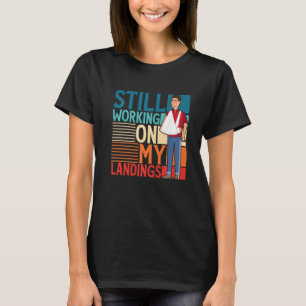 Camiseta Continuando Trabalhando Em Minhas Aterrissagens Qu