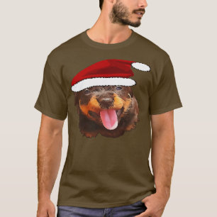 Camiseta Cute Rottweiler Pup Vestindo Holiday Santa Hat