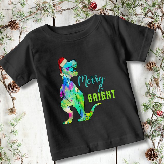 Camiseta Dinossauro de Natal brilhante e feliz (Merry and bright funny Christmas dinosaur colorful T-Rex wearing a santa hat kids T-Shirt)