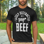 Camiseta Distraído Facilmente Por Beef Funny Steak Lover<br><div class="desc">Apresentando nossa camiseta "facilmente distraída por carne de vaca", projetada para os verdadeiros carnívoros que não resistem ao alento de um bife perfeitamente cozido ou de um hambúrguer suculento. Essa árvore peculiar apresenta texto ousado que orgulhosamente declara seu amor pela carne, acompanhado de uma silhueta elegante de uma vaca enfeitada...</div>