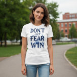 Camiseta Don’t Let Fear Win<br><div class="desc">Stand strong in faith with the Unshakable Warrior “Don’t Let Fear Win” tee. Designed for both men and women,  this bold Christian design reminds you to trust God over fear. Available in multiple styles and colors to fit your everyday look. 💪✝️</div>