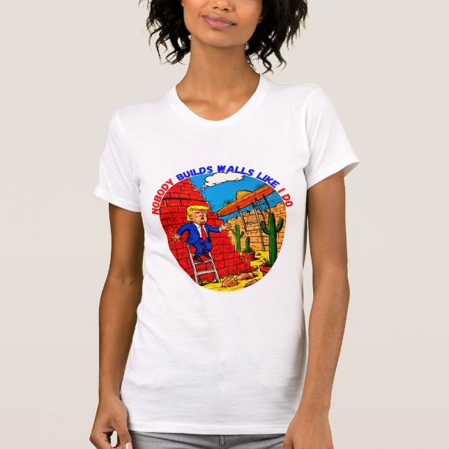 CAMISETA DONALD TRUMP- NINGUÉM CONSTRUI PAREDES COMO EU. (Frente)