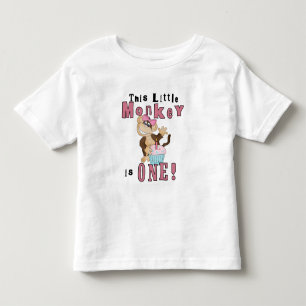 Camiseta e presentes cor-de-rosa do primeiro