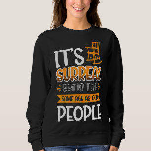Camiseta É surreal ter a mesma idade das Pessoas antigas