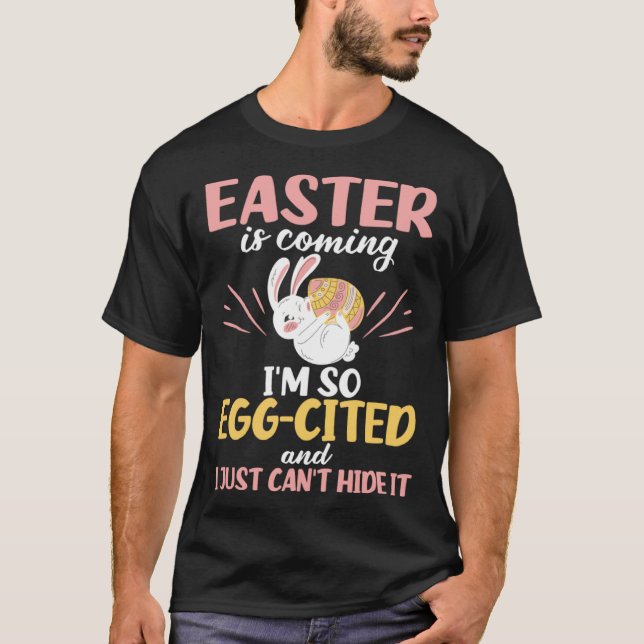 Camiseta Easter Bunny Egg Cited Easter is Coming Egg Christ (Frente)