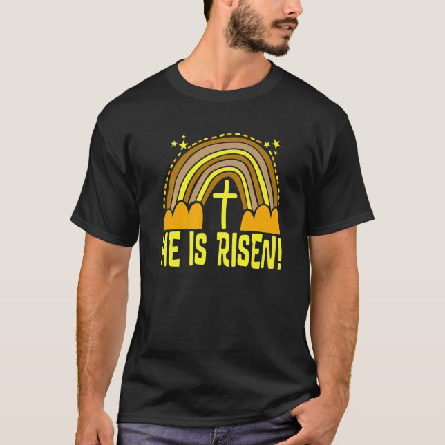 Camiseta Ele Ressuscitou Arco-Íris Páscoa Moderno Fofo Cató (Frente)