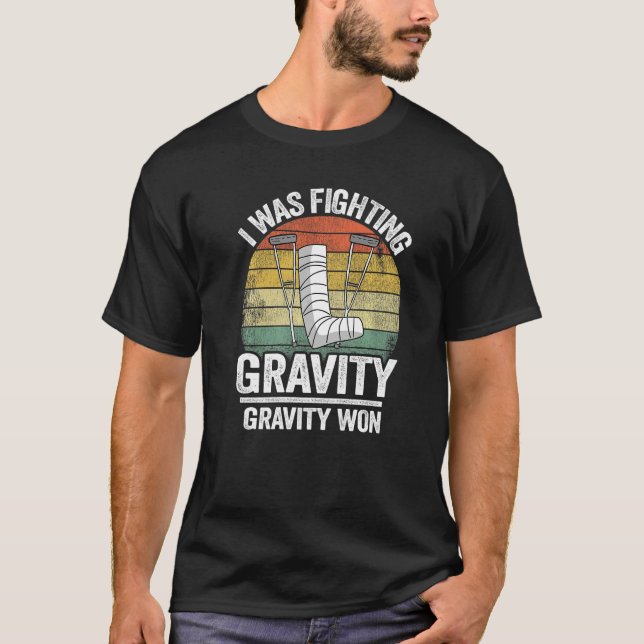 Camiseta Eu Estava Lutando Contra a Gravidade Gravidade Ven (Frente)