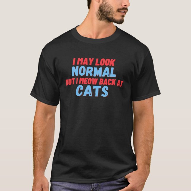 Camiseta Eu posso parecer normal mas eu miau de volta aos g (Frente)