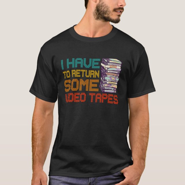 Camiseta Eu Tenho Que Devolver Algumas Fitas De Vídeo, Volt (Frente)