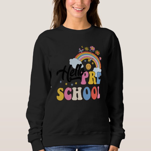 Camiseta Groovy Olá Pré-escola Arco-íris Professores Aluno  (Frente)