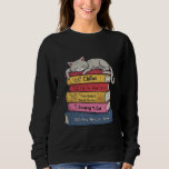 Camiseta How to Chill Like a Cat<br><div class="desc">Description: The artwork depicts a grey tabby cat with its eyes closed in a deep sleep, sprawled across a stack of six colorful books. The illustration style is clean and playful, featuring bold outlines and soft shading. Each book in the stack has a humorous, cat-related title, including "Chillax, " "The...</div>