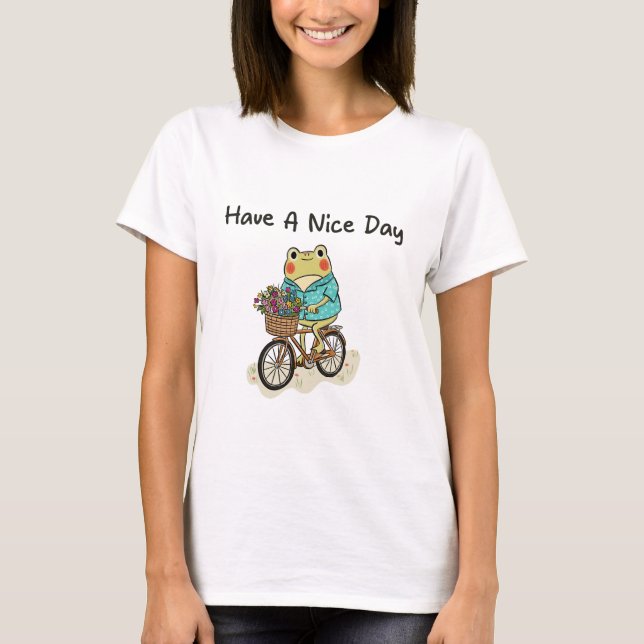 Camiseta Ilustração de um Sapo Caprichoso Andando de Bicicl (Frente)